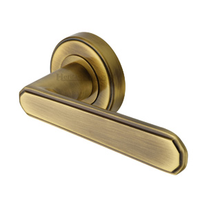 Century Door Handle on Round Rose in Antique Brass
